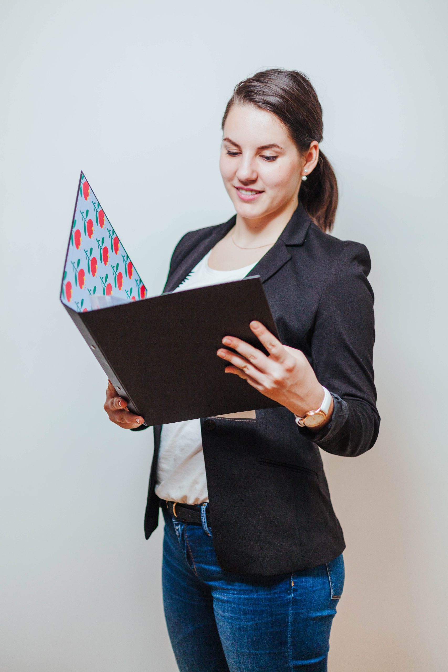 woman-smiling-reading-folder